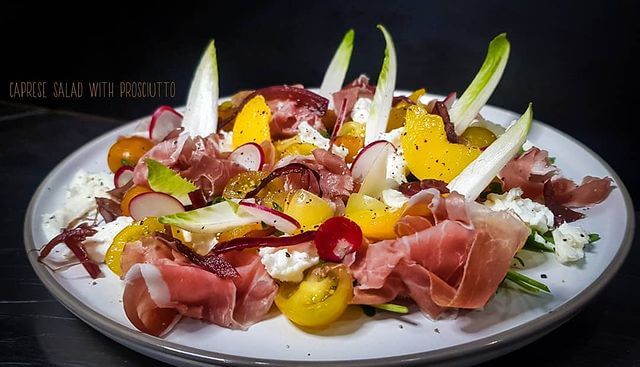 Caprese Salad with prosciutto, peaches and balsamic onion.